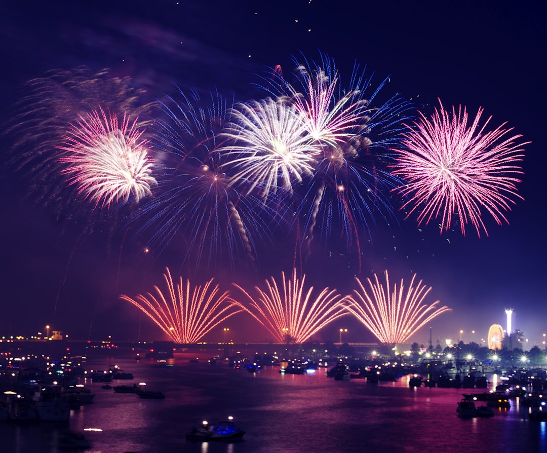 High-resolution fireworks at the city during night photo by Aaron Burden in 4th of July | PictureHub